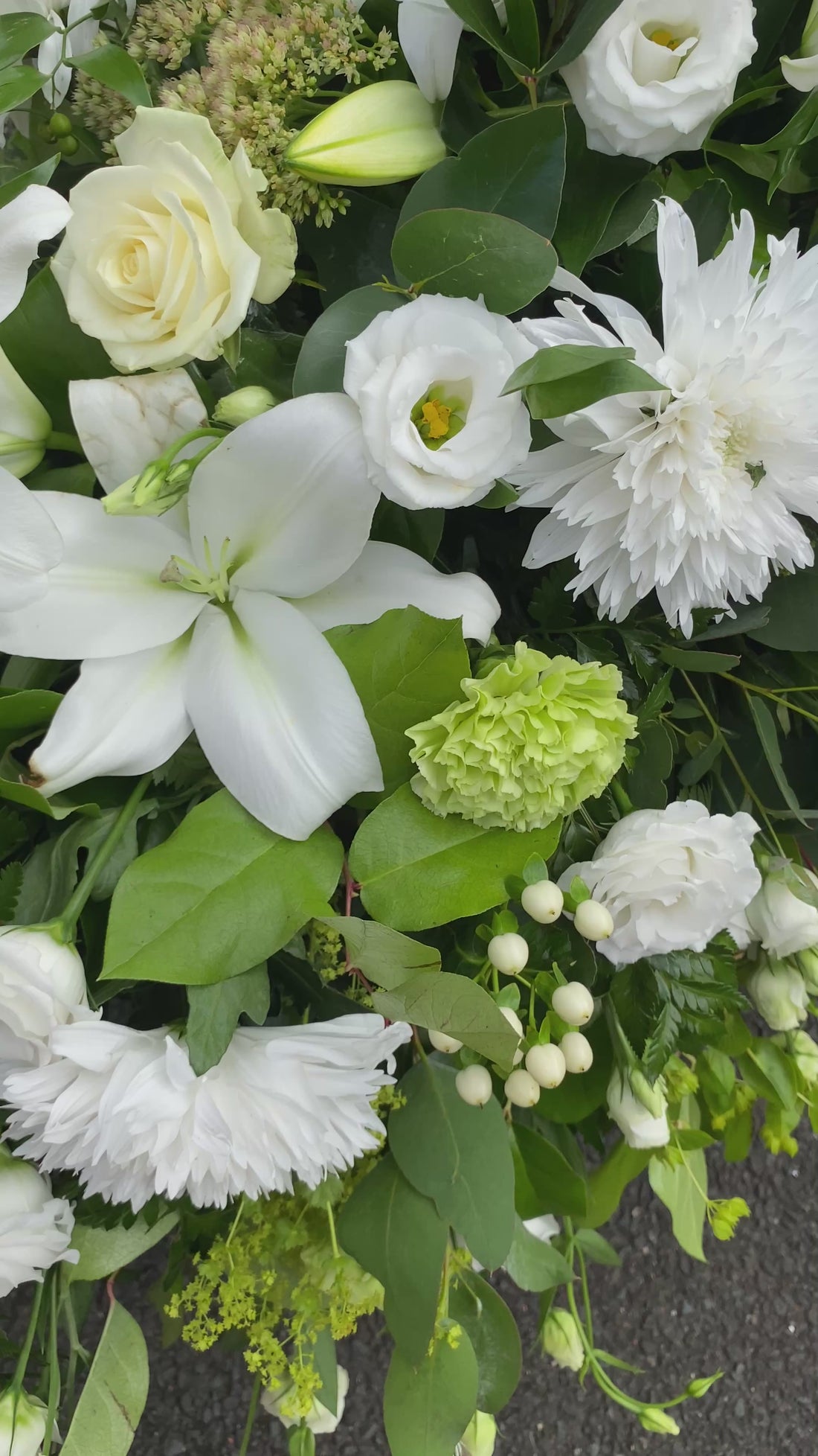 video showing white casket spray